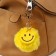 Fluffy on a ring with a carbine "Smile" yellow 8x8 cm