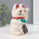 Plastic pendulum "Maneki-Neko White" from the battery 1AA 15.5x11x8 cm