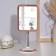 The mirror is desktop, on a flexible leg, bilateral, with an increase, a mirror surface 12.5 × 16 cm, the color of copper/white