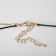 Pendant "chain" totem, a ring with a needle, the color is black in gold, 70cm
