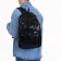 City backpack on a zipper, black color