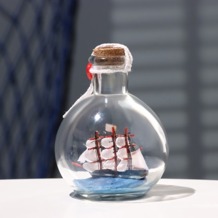 The ship souvenir "trophy", in a bottle, vertical. 9*10cm-1