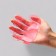 Rubber massage brush on hand, pink