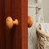 Plastic door handle, d = 65, color is a light tree with a pattern