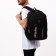 Male backpack on a zipper, 2 parts with a zipper, 5 external pockets, black color