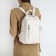 Women's backpack made of artificial leather with zipper, 6 outer pockets, milk color