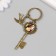 Breek metal, glass "Bird and key with a tree" bronze 10 cm