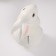 The piggy bank "Rabbit No. 3 is white (paws down)" height 16 cm, width 10.5 cm, length 12.5 cm