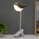 Table lamp on the clothespin "Bird" LED 3000-6000K 5W USB gold 20x7x34cm RISALUX