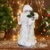 Santa Claus "in a white fur coat with gifts" moves, with backlight, 38 cm