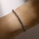 Bracelet with rhinestones "ice" 1 row, white color in silver, 4 mm