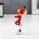 Polystone souvenir "Dancing clown with a cylinder" Red-white 8x3x4.5 cm