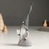 Polystone souvenir "Santa Claus in a gray outfit and a long cap, with a gift" 6.2x5.2x18 cm