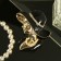 Brooch "Lady in a hat", black and white color in gold