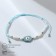 Bracelet-reinforcing “thread of desires” Hams's hand, white blue color
