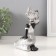 Polystone souvenir "African in a dress with leaves, with a jug, sits" silver 10.5x9x16 cm