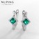 Earrings with rhinestones xuping paradise, green color in silver