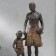 Polystone souvenir "African with son" under a tree 32x15.5x9 cm