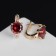 Earrings with bloom rhinestones, red color in gold