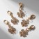 Charm "Clover", white color in gold