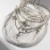 The chocker-kore multi-layer "cross" pearl, white color in silver