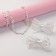 Set "chosen" 4 items: 2 elastic bands, beads, bracelet, bunny, white color
