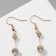 Hanging earrings with rhinestones "Drop" path, white color in gold, 6.2 cm