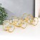 Summary metal, glass for 5 candles "double rings" d-4.5 cm gold 33.5x6.5x12.5 cm