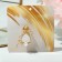 Broach "Bunny" with a bow, the color is white in matte gold