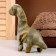 Soft musical toy "Dinosaurus", 20 cm, dark green color