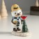 Polystone souvenir "Snowman with a cup on his head, feeds a bird at the Christmas tree" 9.5x6x11 cm