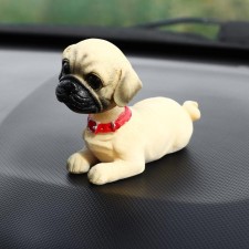 Dog on a car panel shocking his head, dog