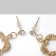Earrings with rhinestones "Heart" interweaving, white color in gold