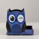 The stand for the office is a wooden owl "owl, winks", with a print, blue