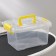 The storage container is plastic, 20 × 15 × 11 cm, a cover with a handle on a latch, matte