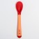 A spoon for feeding, thermal sensitive, red-beige color