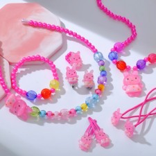 The kit of children's “chosen” 9 objects: rim, 2 elastic bands, 2 hairpins, clips, pendant, bracelet, ring, bunnies, mixing color