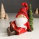 Souvenir Polystone Light "Santa Claus in a red outfit sits at the Christmas tree" 14x7x18 cm