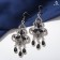 Hanging earrings with rhinestones "East" Trilist, black color in black silver, 8 cm