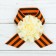 Icon with ribbon and light beige flower on Victory Day "May 9"