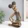 Polystone souvenir "Girl with curly tails, with a dish" under bronze 19x12x27 cm