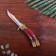 Wooden souvenir "Butterfly knife" Rainbow lines