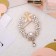 Brooch "Halu", white color in gold