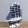 The ship souvenir medium "Kalev", the sides are blue with a white strip, the sails are blue, 30x7x32 cm