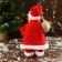 Santa Claus "in a patterned vest, with gifts" moves, with backlight, 28 cm, red