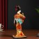 Collectible doll "Geisha in an orange kimono with a fan" 22.5 cm