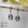 Earrings with rhinestones "Illusion" Ovol voluminous, brown-green color in silver