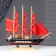 The ship souvenir medium "Flora", Black side with a white strip, red sails, 32x6.5x31 cm