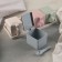 A set of cans for bulk products on a stand, 4 pcs with spoons, color mix