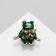 Brooch "Frog" with a bow, green color in gold